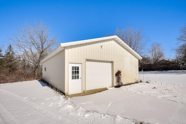 view of snow covered garage