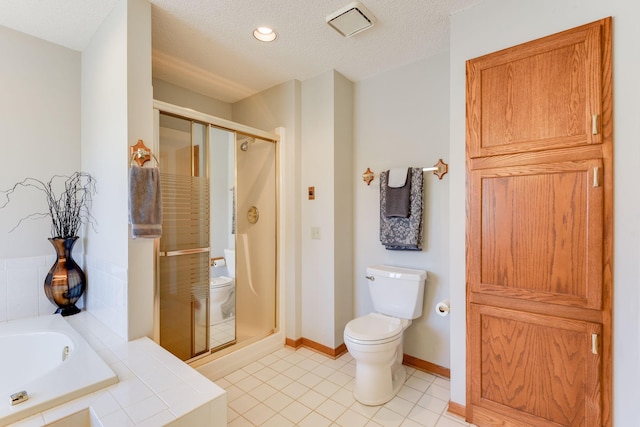 bathroom with tile patterned flooring, plus walk in shower, a textured ceiling, and toilet