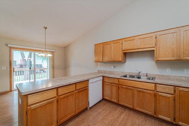 kitchen with dishwasher, sink, decorative light fixtures, kitchen peninsula, and a chandelier