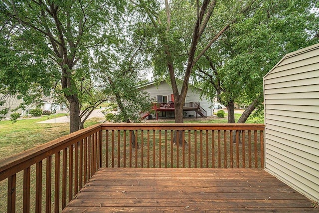 wooden deck with a lawn