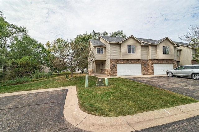 view of front facade featuring a garage and a front lawn