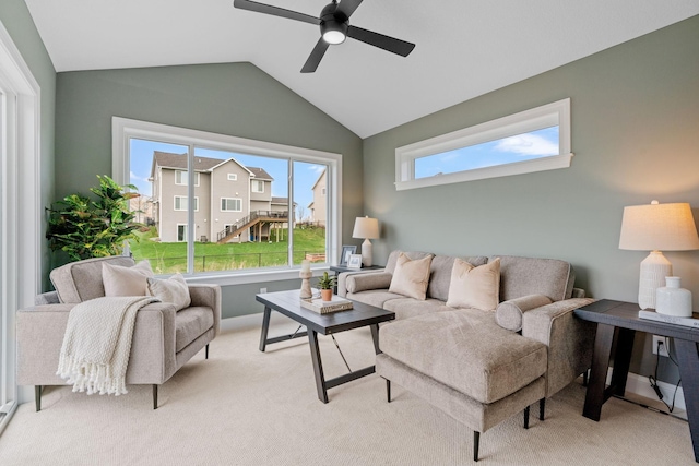 living room with light colored carpet, lofted ceiling, a wealth of natural light, and ceiling fan