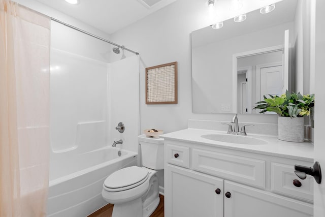 full bathroom with vanity, toilet, hardwood / wood-style flooring, and bathing tub / shower combination