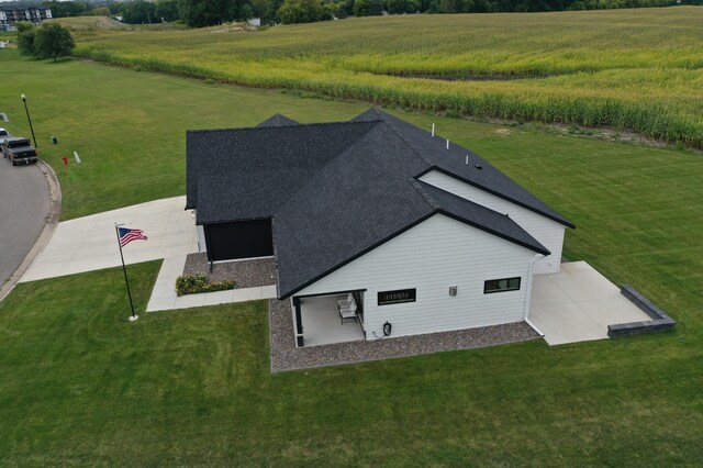 birds eye view of property with a rural view