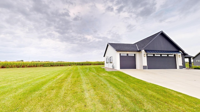 modern farmhouse style home featuring a garage and a front lawn