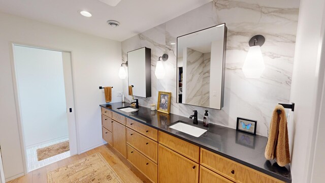 bathroom featuring vanity and hardwood / wood-style floors