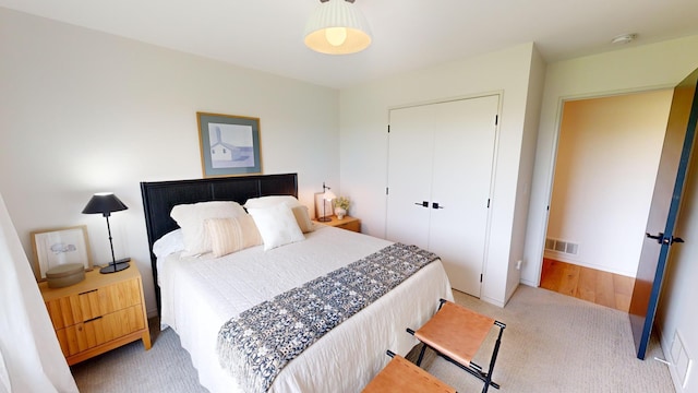 carpeted bedroom with a closet