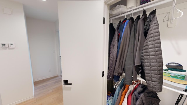 spacious closet featuring light hardwood / wood-style floors