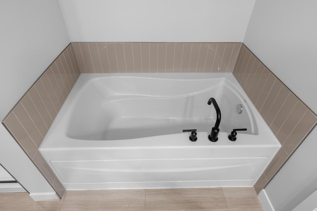 bathroom with a garden tub