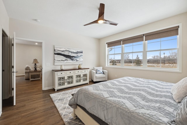 bedroom featuring ceiling fan and dark wood-type flooring