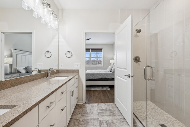 bathroom with vanity and an enclosed shower