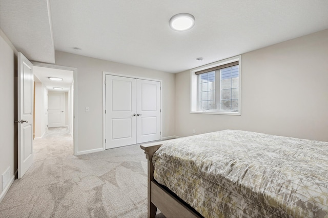 carpeted bedroom featuring a closet