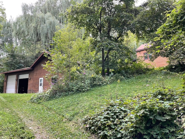 view of yard with a garage