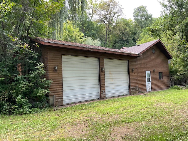 garage with a yard