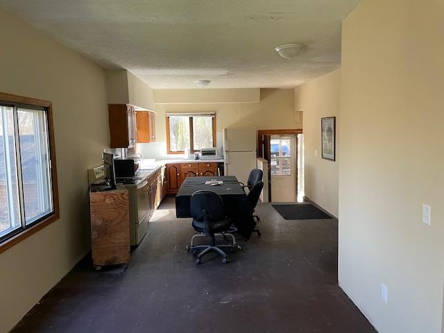 office with a textured ceiling and sink