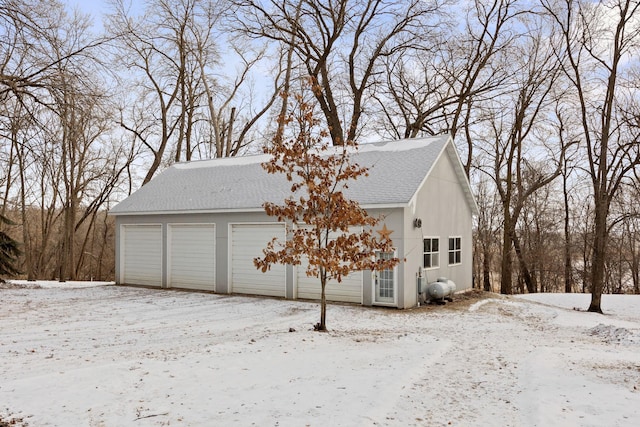 view of snow covered garage