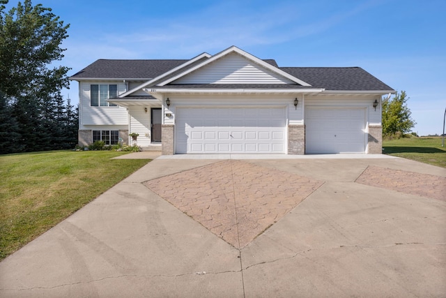 view of front of home featuring a garage and a front yard