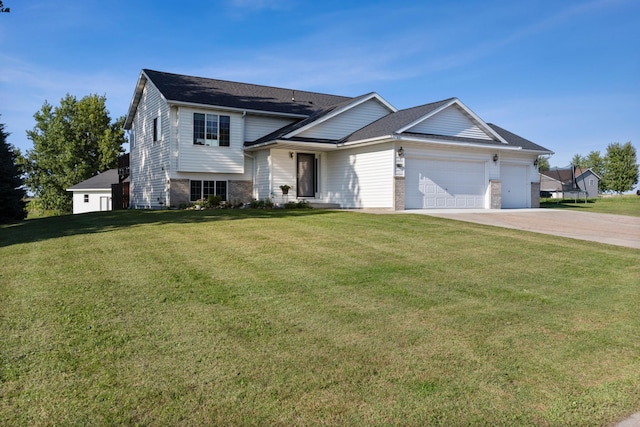 view of front of house with a garage and a front lawn