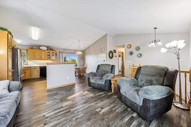 living room with a textured ceiling, lofted ceiling, a notable chandelier, and dark hardwood / wood-style floors