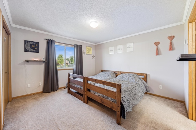 carpeted bedroom with a textured ceiling, crown molding, and a closet