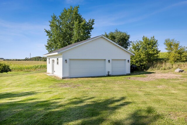 garage featuring a yard