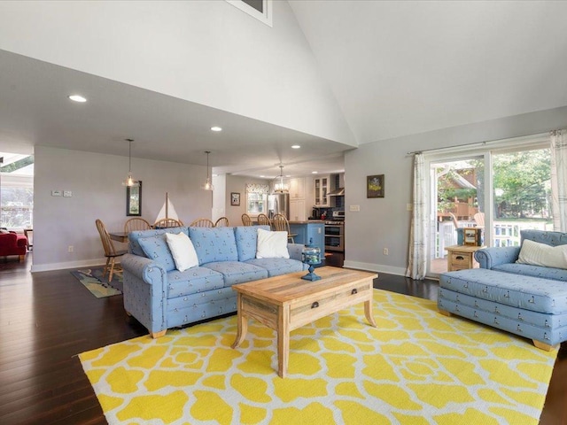 living room featuring recessed lighting, high vaulted ceiling, baseboards, and wood finished floors