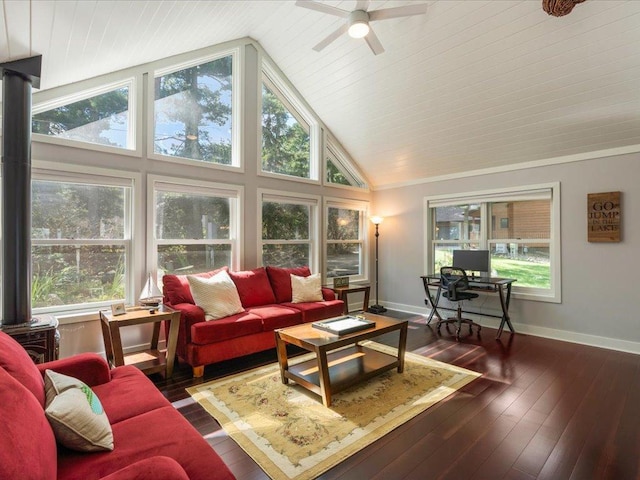 living room featuring a healthy amount of sunlight, wood-type flooring, and high vaulted ceiling