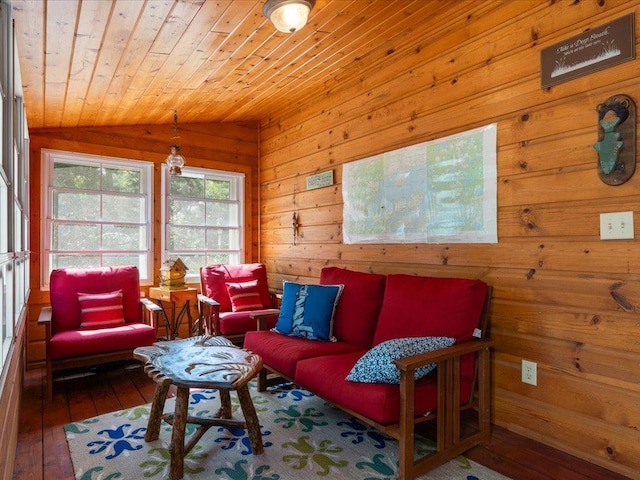 living area featuring wooden walls, wood ceiling, lofted ceiling, and wood-type flooring