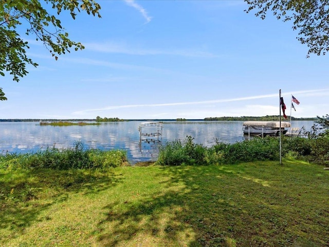 exterior space with a yard and a water view