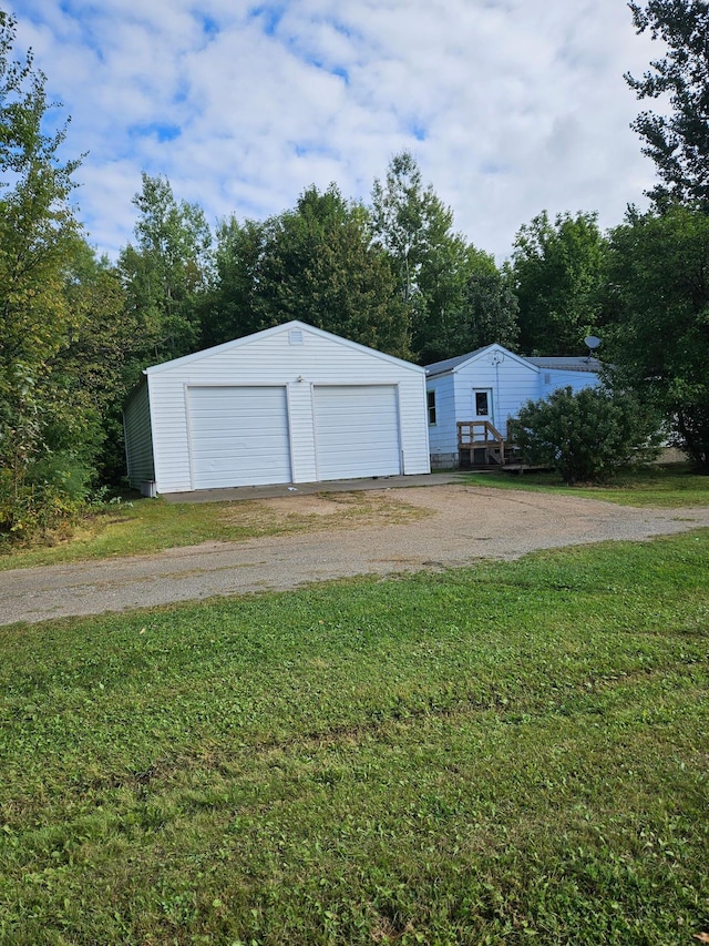 garage with a yard