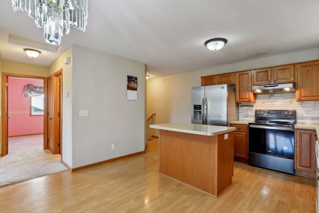 kitchen with electric range oven, a kitchen island, stainless steel fridge with ice dispenser, and light hardwood / wood-style flooring