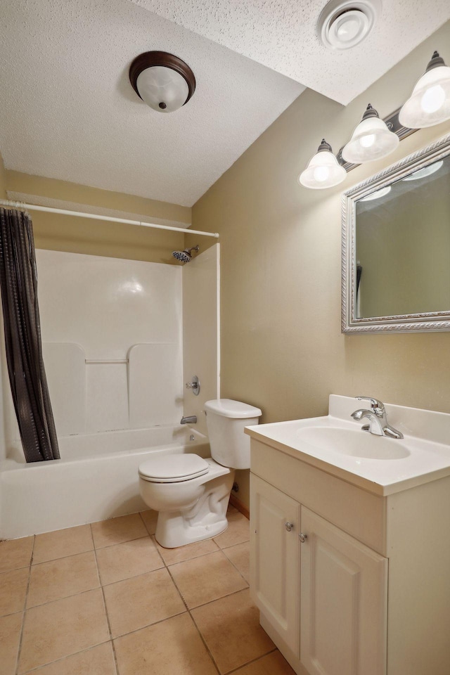 full bathroom featuring shower / tub combo, vanity, a textured ceiling, toilet, and tile patterned floors