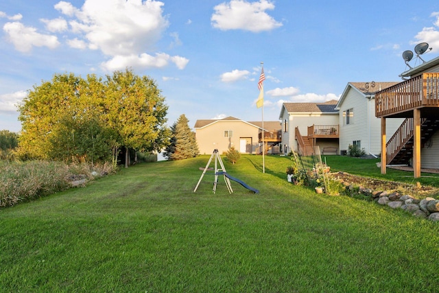 view of yard featuring a wooden deck