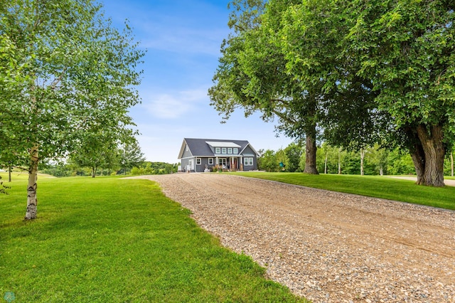 view of property's community with a lawn