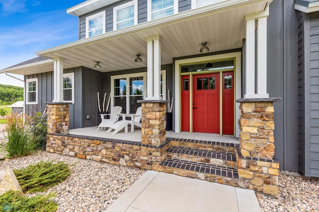 25002 State Highway 108, Lida Twp, MN 56572 - view of exterior entry featuring board and batten siding and a porch