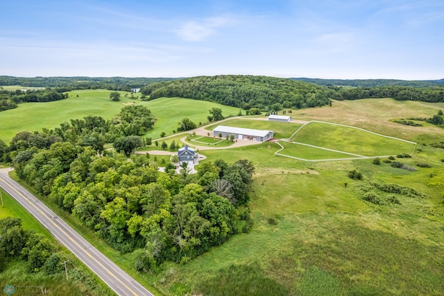 birds eye view of property with a rural view