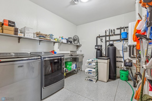 clothes washing area featuring washing machine and clothes dryer