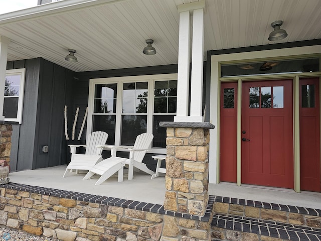 view of exterior entry featuring a porch