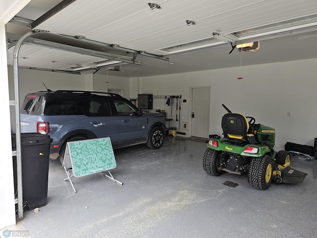 garage featuring a garage door opener and electric panel