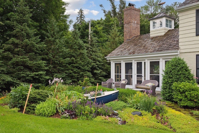 view of yard with a sunroom