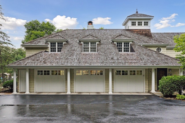 garage featuring aphalt driveway