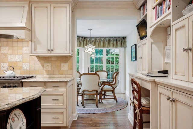 kitchen featuring custom exhaust hood, ornamental molding, dark wood-type flooring, cream cabinets, and tasteful backsplash