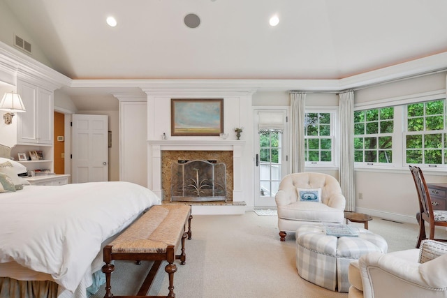 bedroom with access to outside, visible vents, light colored carpet, and vaulted ceiling