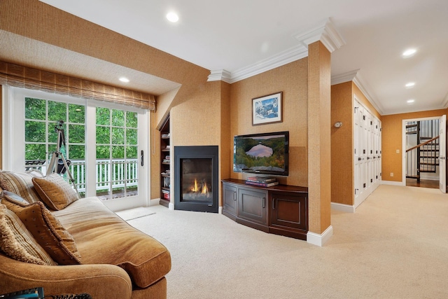 carpeted living room featuring a large fireplace, baseboards, stairway, ornamental molding, and recessed lighting