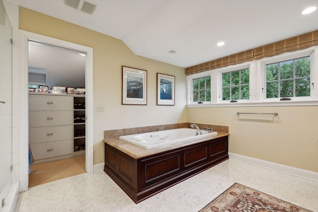 bathroom with a bath, visible vents, recessed lighting, and baseboards