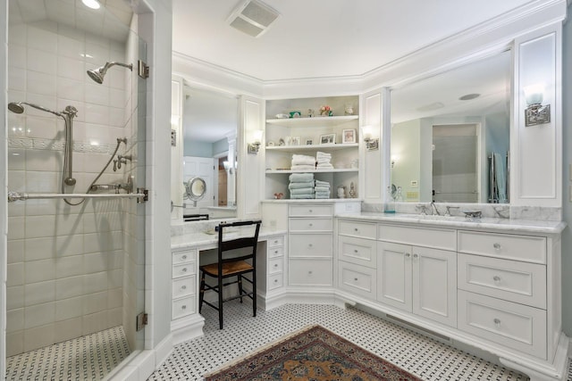 bathroom featuring vanity, crown molding, visible vents, and a stall shower