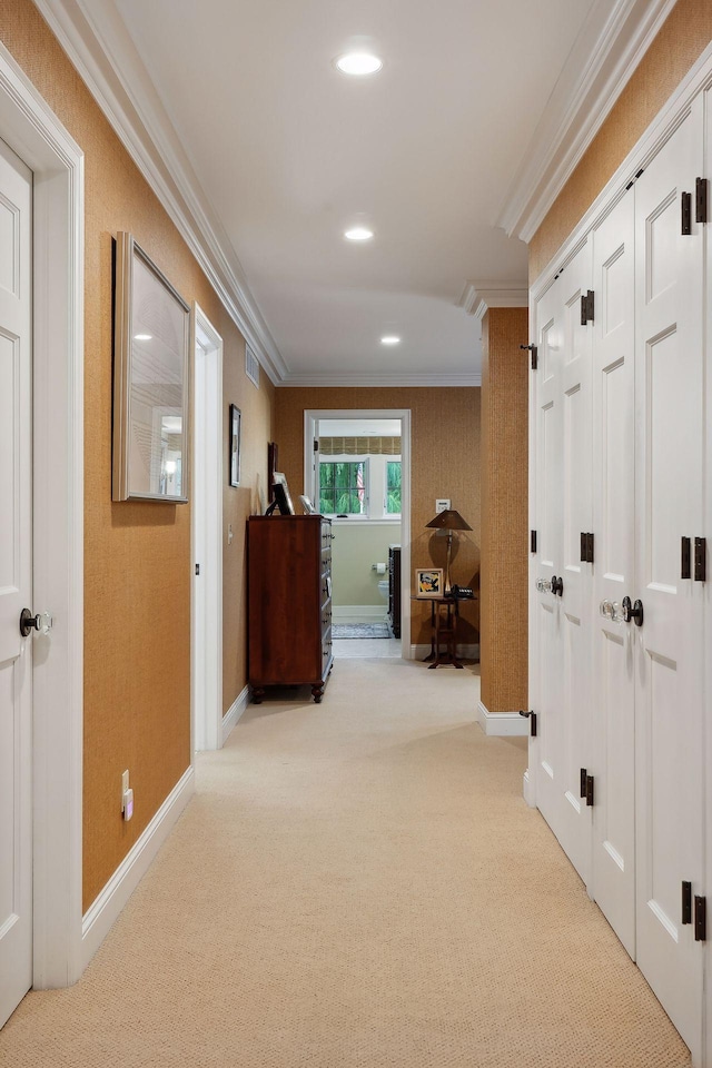 hallway with visible vents, ornamental molding, recessed lighting, carpet, and baseboards