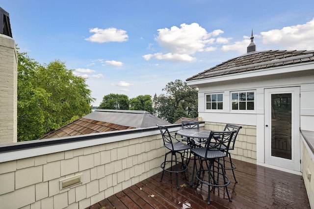 wooden deck with outdoor dining area