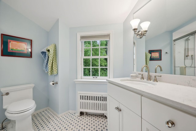 full bathroom featuring a shower stall, radiator, baseboards, toilet, and vanity