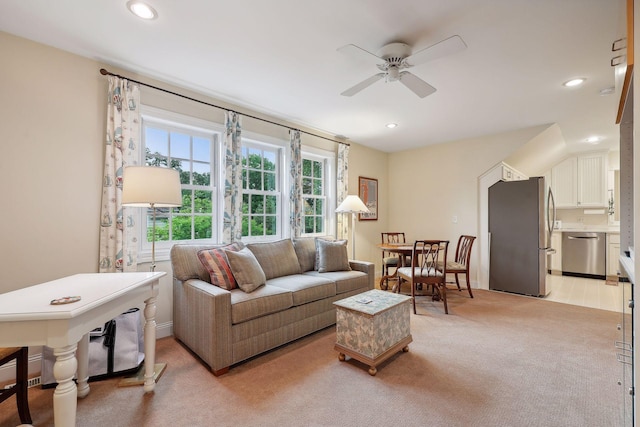 living room with recessed lighting, light carpet, and a ceiling fan